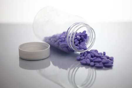 Purple pills in glass jarsの写真素材