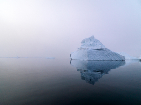 Arctic iceberg in a foggy dayの写真素材
