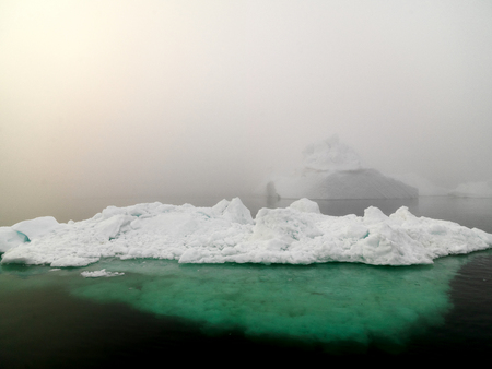 Arctic iceberg in a foggy dayの写真素材