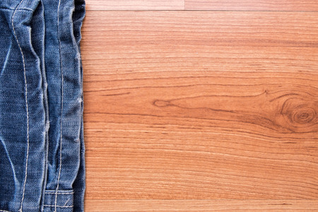 texture of denim and stitch on wooden backgroundの写真素材