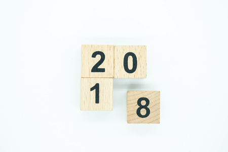 2018 New year concept. Top view of wooden number block toy on white background.の写真素材