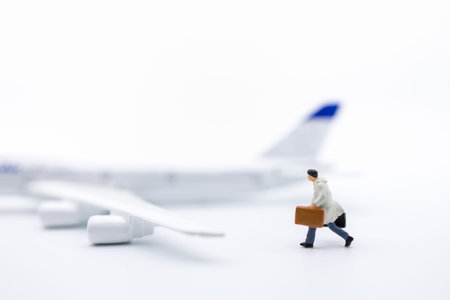 Business Travel and transportation Concept. Close up of businessman traveler miniature figure with...