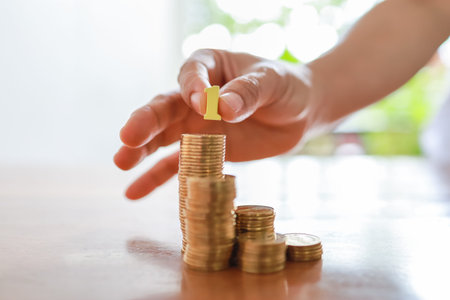 Business, Money, Finance, Secure and Saving Concept. Close up of woman hand holding yellow wooden...