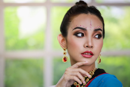 Portrait of beautiful young asian Thai girl. Woman model with kundan jewelry set and traditional...