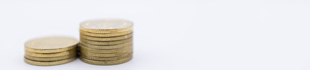 Money, Business and Saving  cover page Concept. Closeup of two stack of gold coins on white...