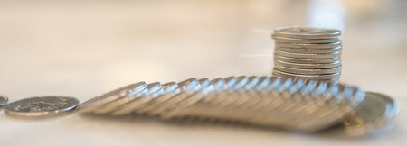 Closeup of stack of coins with pile of coins. Money, Business and Risk Management COncept.