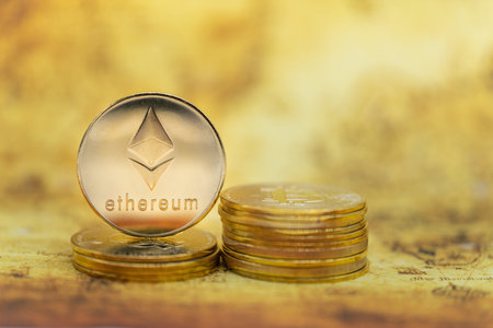 Business , Money, Technology and  cryptocurrency Concept. Closeup of gold Ethereum coin on stack of...