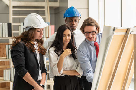 Diversity Business people work place and Construction Concept. Group of businessman and Engineer or architect meeting for project working in office.の写真素材