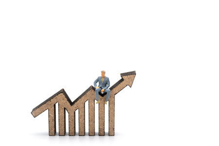 Business and Planning concept. Closeup of businessman miniature figure people sitting on wooden bar...