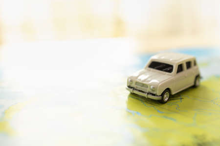 Travel and Transport Concept. Closeup of mini toy white car on world map with copy space.の写真素材