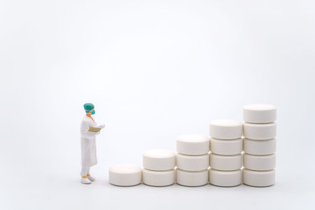 Healthcare and Medical Concept. Closeup of woman doctor miniature figure with patient file looking...