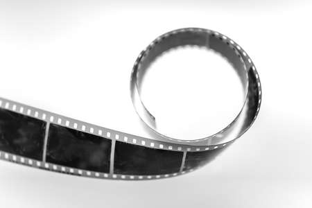 35mm Monochrome camera film strip on white background.の写真素材