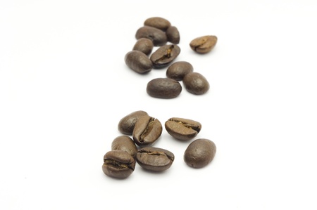 a few of coffee beans, isolated on white.の写真素材