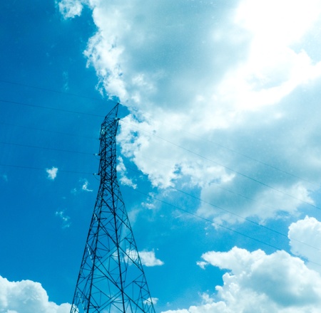 transmission towere against dramatic blue sky with clouds.の写真素材