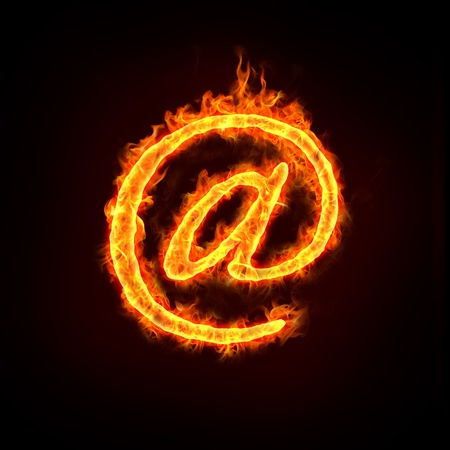 a burning at sign with flames, for email concepts.の写真素材