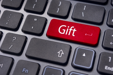 Gift concepts or buying a gift online, with a message on keyboard enter key.の写真素材