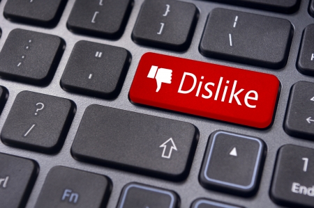 A dislike message on enter keyboard for anti social media concepts.の写真素材