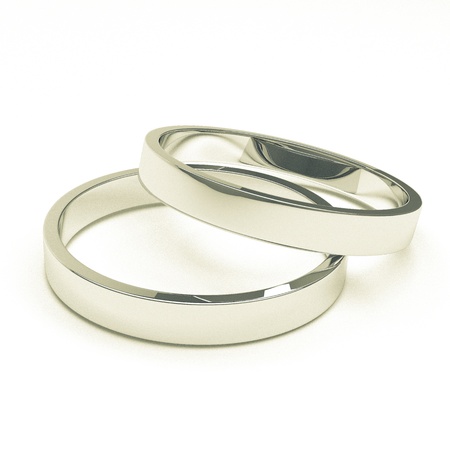 A pair of isolated silver or platinum weddings rings.の写真素材