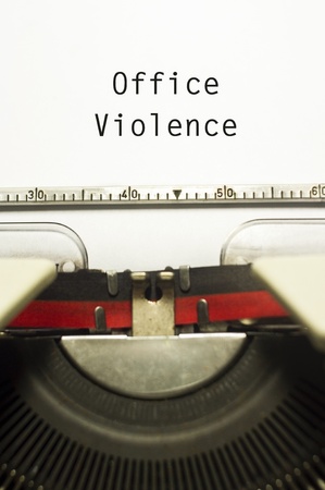 office or workplace violence, with message on typewriter paper.の写真素材