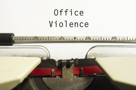 office or workplace violence, with message on typewriter paper.の写真素材