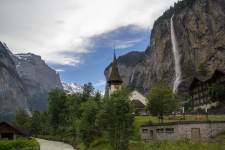 Lauterbrunnen Switzerland with church and waterfallのeditorial素材