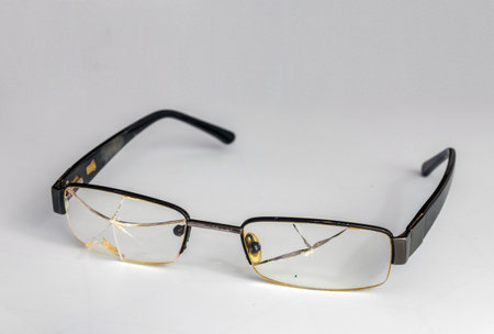 Broken Eyeglasses On White Backgroundの写真素材