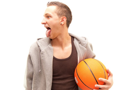 basketball player having fun, holding a orange ball