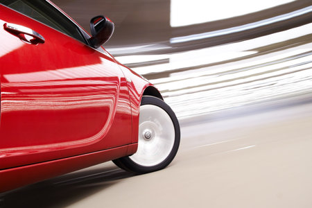 Side view of turning luxury car in motion