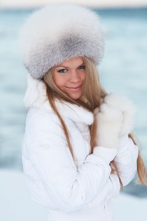 Young woman on a winter seacoastの写真素材