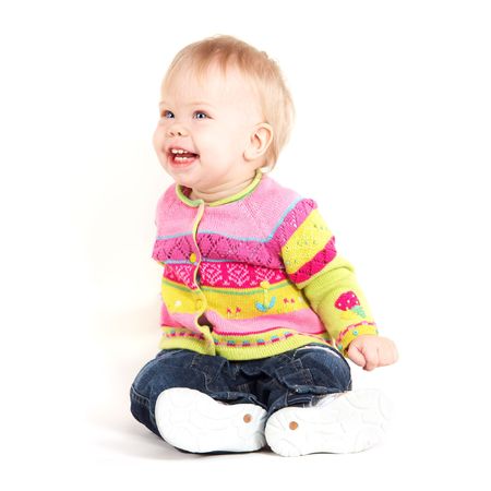 Beautiful babygirl in colorful jacket on white backgroundの写真素材