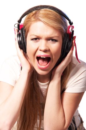 Young screaming girl in headphones の写真素材