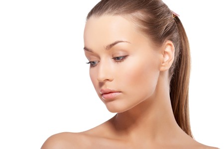 Closeup portrait of beautiful female model with blue eyes on white backgroundの写真素材