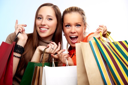 Two happy teenage girls on a shoppingの写真素材