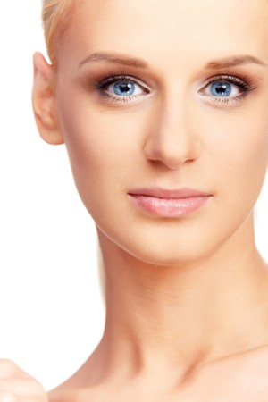  Closeup portrait of beautiful female model with blue eyes on white backgroundの写真素材