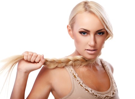 Portrait of a young lady with a braid isolated on white backgroundの写真素材