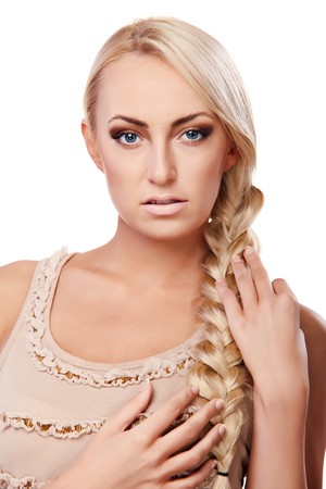 Portrait of a young lady with a braid isolated on white backgroundの写真素材