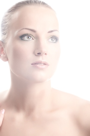 High key portrait of a beautiful woman isolated on whiteの写真素材