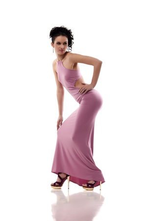 Young lady in pink dress isolated on white backgroundの写真素材