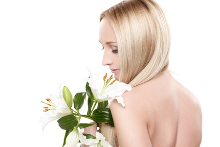 Closeup portrait of female model holding white orchidの写真素材