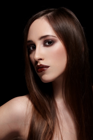 Sensual brunette lady portrait on black backgroundの写真素材
