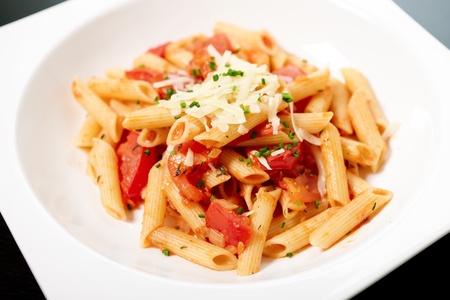 Pasta with tomato sauce and herbsの写真素材