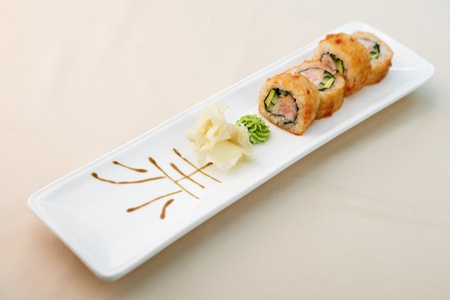 Crab maki with wasabi and ginger on a plateの写真素材