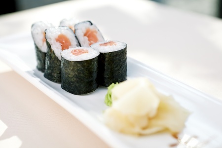Tuna maki with wasabi and ginger on a plateの写真素材