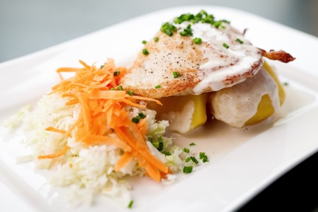 Chicken Stuffed with cream cheese, tomato, carrot and cabbage saladの写真素材