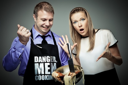 Man cooking some strange things and his wife is shockedの写真素材