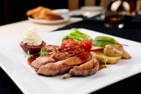 Roasted duck with pear,marinated in red wine and mascarpone roseの写真素材
