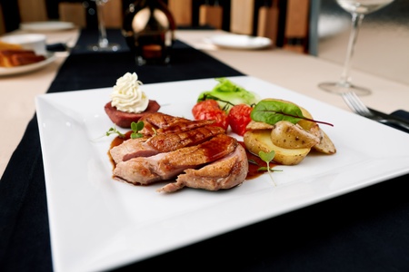 Roasted duck with pear,marinated in red wine and mascarpone roseの写真素材