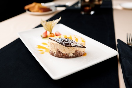Sea buckthorn cheesecake on a plateの写真素材