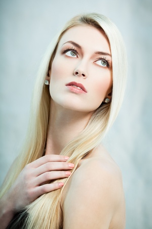 Fashion portrait of blond lady looking upの写真素材