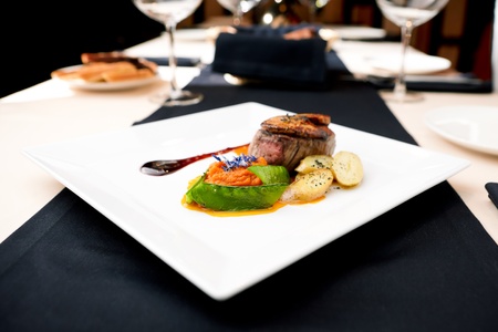 Beef fillet with potato gratin and fresh saladの写真素材